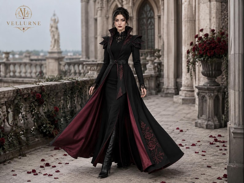 Dark queen gothic costume with flowing black and burgundy vampire coat, Victorian embroidery and dramatic long-length movement.