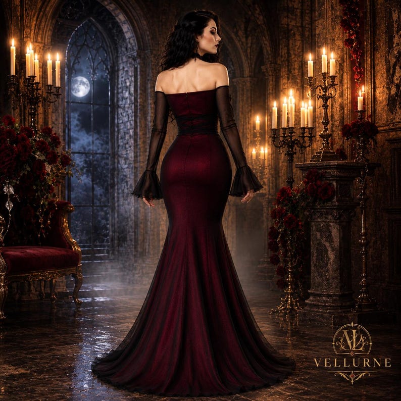 May include: A floor-length, off-the-shoulder gown in deep burgundy with a fitted bodice and a flared mermaid skirt. The dress features long, sheer black sleeves with flared cuffs and a dark, flowing hemline that pools slightly on the floor.
