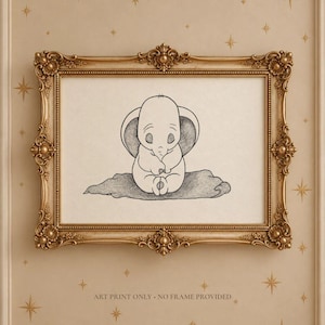 May include: A black and white line art drawing of a small elephant with large ears sitting on a textured surface, enclosed in an ornate gold-colored frame. The text at the bottom reads: ART PRINT ONLY - NO FRAME PROVIDED.
