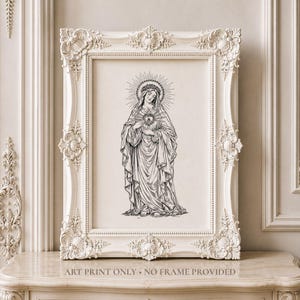 Peut inclure: Une illustration en noir et blanc représentant une figure avec une auréole et un cœur rayonnant, encadrée dans un cadre rectangulaire orné de couleur crème. Le texte en bas de l'impression indique : ART PRINT ONLY - NO FRAME PROVIDED.