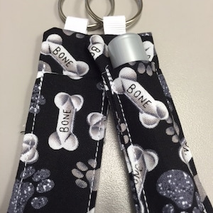 Black Dog bone and print fabric lip balm /chapstick holder keychain. FREE SHIPPING!
