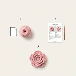 May include: A craft kit containing a ball of light pink yarn, a printed instruction sheet titled Crochet Flower with step-by-step text and images, a wooden crochet hook, and a finished light pink crocheted flower with layered petals.