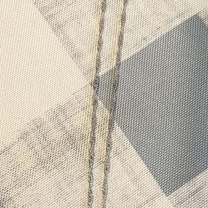 May include: Silver-toned necklace with a heart-shaped pendant. The pendant is encrusted with small, clear stones around the edge. The chain has a delicate, twisted design. The necklace rests on a blue and white checkered surface.