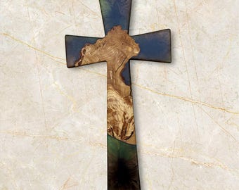 May include: A wooden cross with a blue and green resin inlay. The cross is made of natural wood with a unique grain pattern.