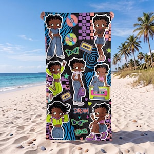 May include: A rectangular beach towel featuring a black background with multiple illustrations of Betty Boop in various outfits, cassette tapes, CDs, sunglasses, and hearts. The text "DREAM" and "VIBES" is printed in a colorful, stylized font.