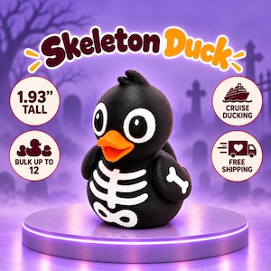 May include: A black rubber duck figurine featuring a white skeleton print on the chest and wings, an orange beak, and large white eyes. The text Skeleton Duck is displayed above, with 1.93 inches tall noted on the left side.