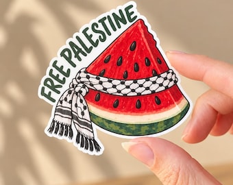 May include: A die-cut sticker featuring a slice of watermelon with a black and white keffiyeh wrapped around its centre. The text FREE PALESTINE is printed in dark green capital letters along the top edge of the watermelon slice.
