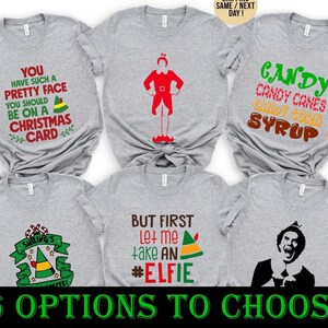 May include: Six heather gray short-sleeve t-shirts featuring various Christmas-themed graphic prints. Designs include text such as 'You have such a pretty face', 'Candy, candy canes, candy corn, syrup', and 'But first let me take an #elfie', alongside elf-themed illustrations.
