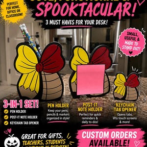 May include: A three-piece desk accessory set featuring a butterfly-shaped pen holder, a butterfly-shaped post-it note holder with a pink sticky note, and a small butterfly-shaped keychain tab opener, all with yellow, red, and brown accents.