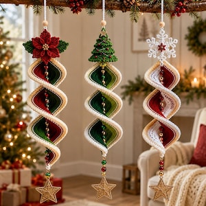 May include: Three hanging spiral ornaments featuring crocheted designs. The left has a red poinsettia, the centre a green Christmas tree, and the right a white snowflake. Each spiral is made of red, green, and white yarn with gold beads and a gold star.