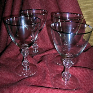Set of four goblets with platinum rims