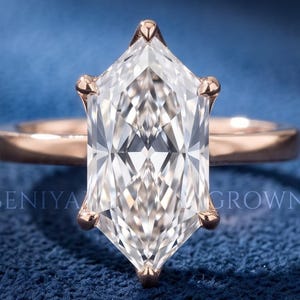 3.59 carat Dutch marquise lab grown diamond solitaire engagement ring with six prong setting and plain polished band.