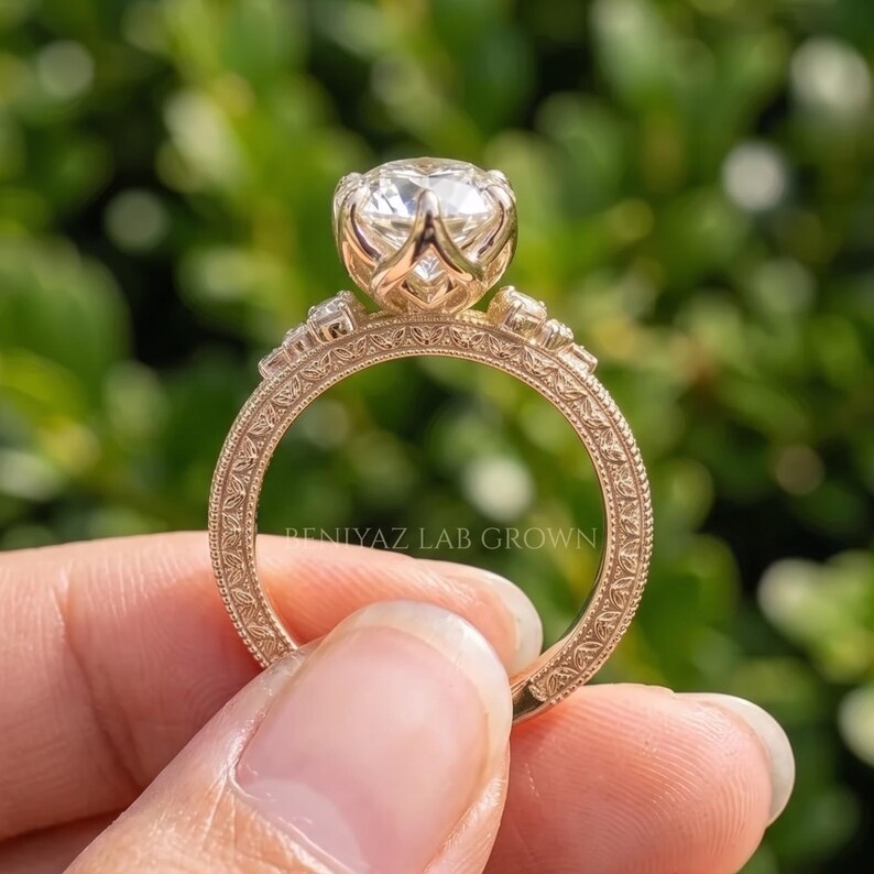 Angled front view of a 3 carat marquise engagement ring showing the centre stone and ornate vintage inspired shoulders.