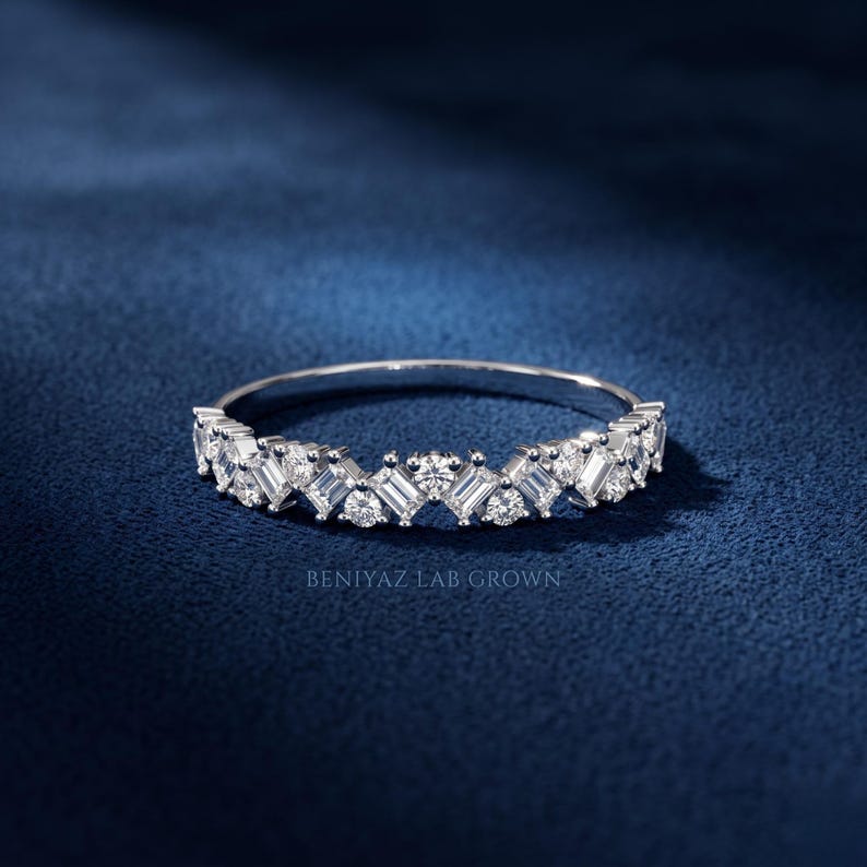 Elegant contour wedding ring with lab grown diamonds in a curved white gold chevron band design
Stackable curved diamond wedding band in white gold with sparkling round and baguette style stones
