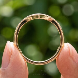 Rear circular view of moissanite wedding band showing the smooth shank and curved nesting design.
