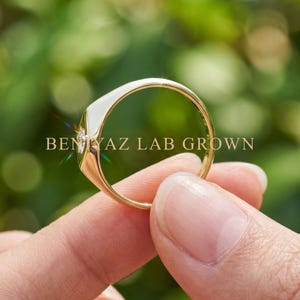 Signet ring men or women design shown from the back, with slim 1.3 mm band and polished tapered gold shank.