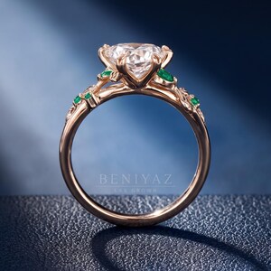 Side profile of a nature inspired Dutch marquise engagement ring showing the elevated centre diamond setting and openwork rose gold vine shank.