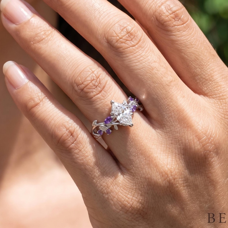 Nature inspired ring for women worn on hand, featuring Dutch marquise lab diamond and delicate purple gemstone accents.