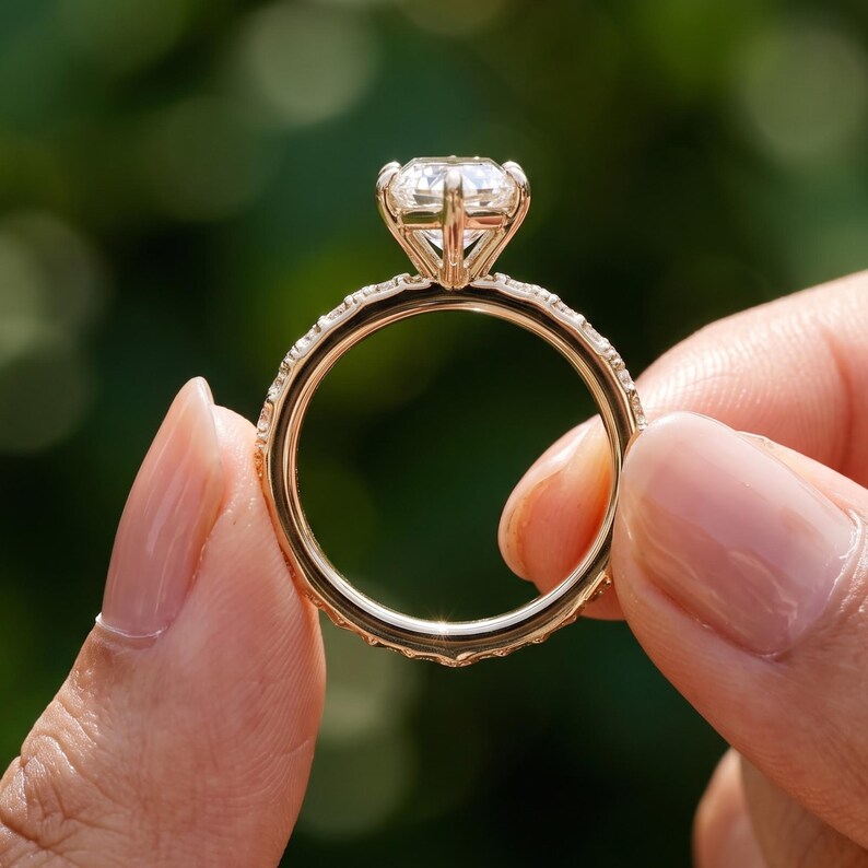 Side profile of a marquise lab grown diamond ring showing the elevated prong setting and detailed gold band.