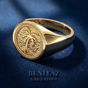 Yellow gold vermeil palm tree signet ring with round medallion face, textured tropical design and polished tapered pinky ring band
