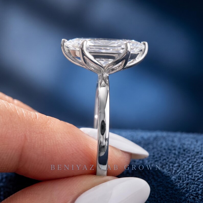 Side profile of Dutch marquise lab grown diamond engagement ring showing the raised tulip basket and six prong solitaire setting.