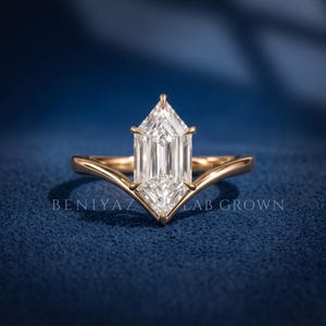 Front angled view of a Dutch Marquise lab grown diamond solitaire ring showing the geometric center stone and yellow gold setting.