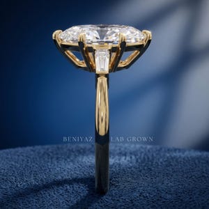 Side profile studio photo of Dutch marquise engagement ring showing elevated center setting and slim polished band