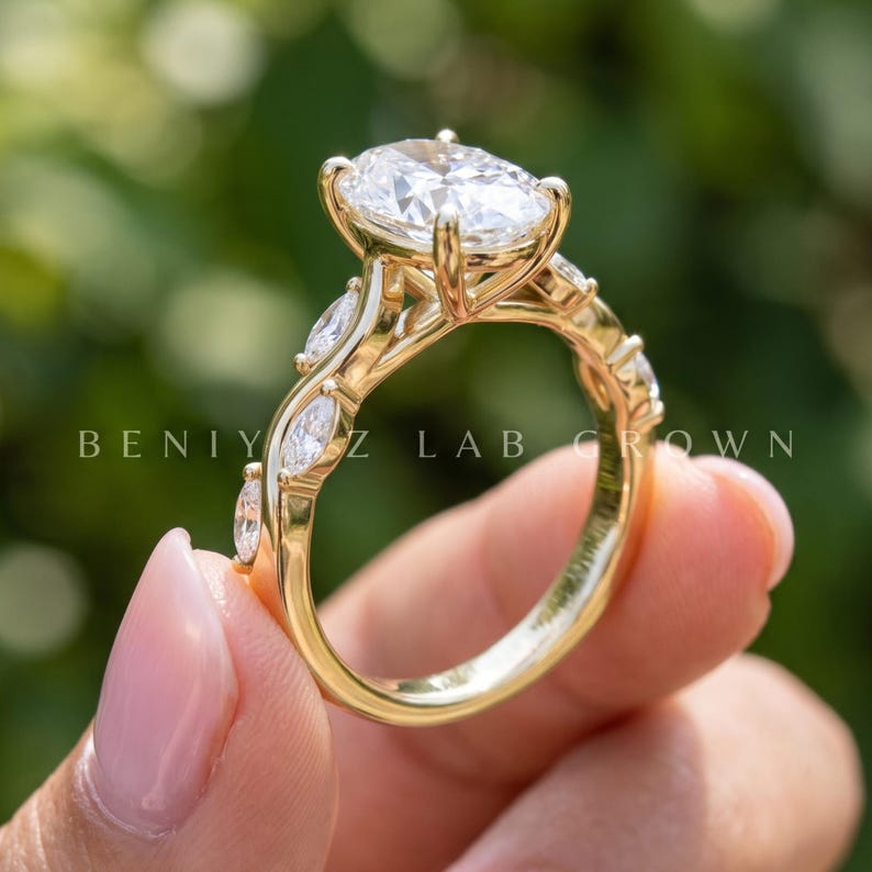 Angled side view of vintage oval engagement ring with lab grown diamond center, detailed shoulders and slim gold band.