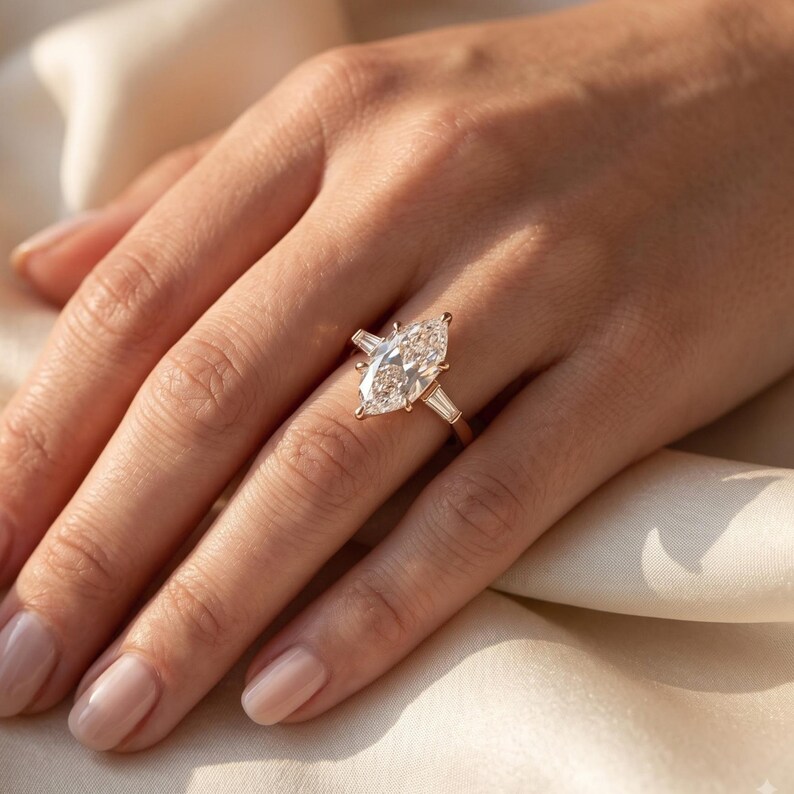 Woman wearing 2 carat Dutch marquise lab grown diamond engagement ring on hand for realistic scale and bridal styling