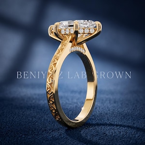 Side profile of a marquise lab grown diamond ring showing the elevated setting, hidden halo and ornate yellow gold shank.