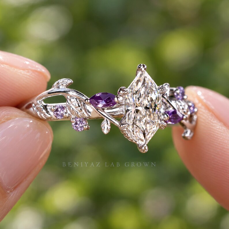 Botanical ring with Dutch marquise lab diamond, purple Tanzanite accents and detailed leaves shown in outdoor natural light.