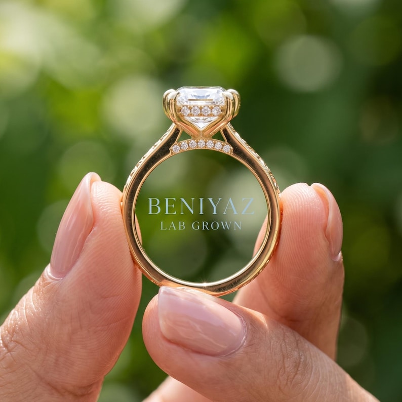 Side gallery view of a marquise lab grown diamond engagement ring highlighting the raised setting and hidden halo beneath the centre stone.