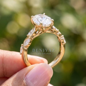 Three quarter side view of oval diamond engagement ring showing the elevated center setting and delicate 14K gold shank.