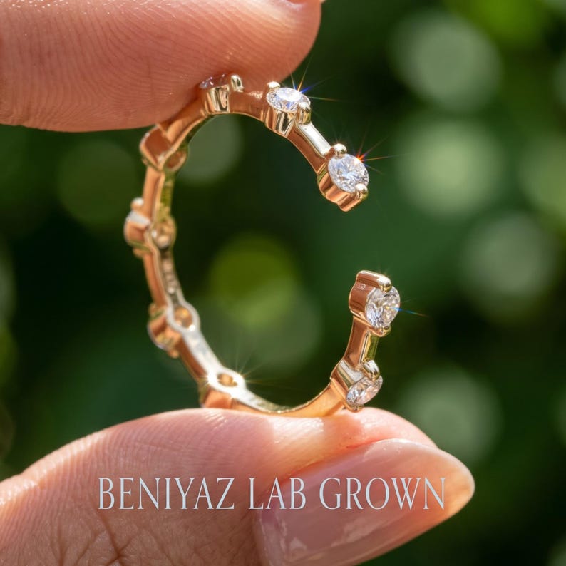 Open wedding band in yellow gold with spaced round lab grown diamonds and a diamond at each end of the gap