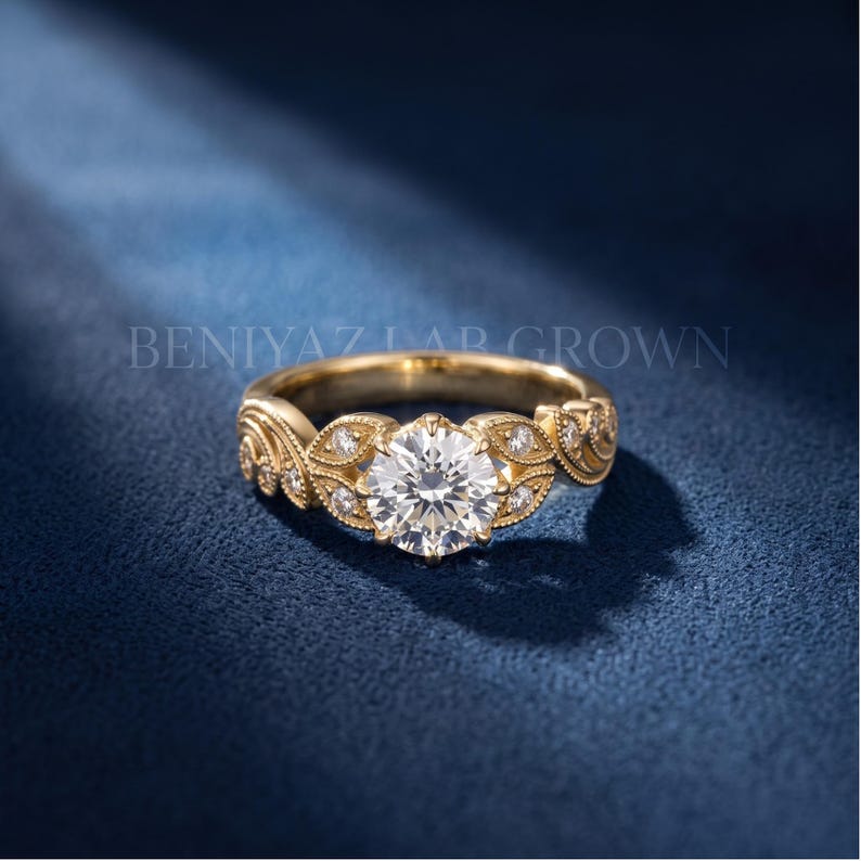 Round lab grown diamond vintage engagement ring in white gold, featuring a brilliant solitaire center stone surrounded by elegant floral leaf details and accent diamonds.