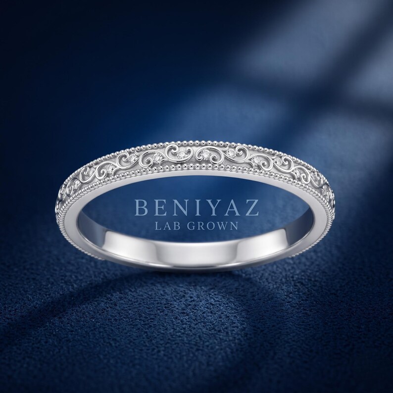 White gold ornate scroll milgrain wedding band with engraved vintage pattern, delicate stackable ring, classic bridal band with antique styling.