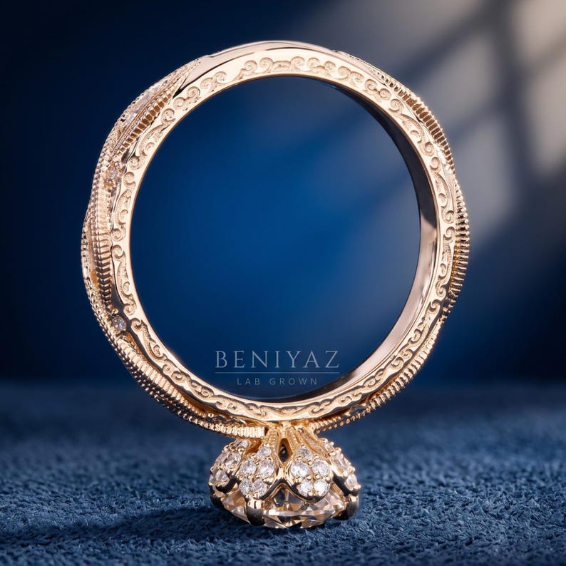 Angled view of an oval lab grown diamond solitaire showing the detailed milgrain band with marquise and round diamond accents.