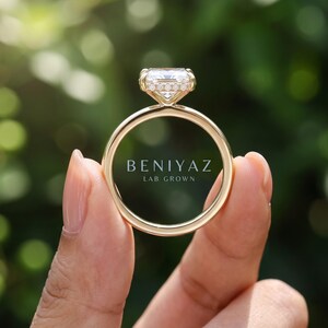 Front view of a Dutch marquise lab grown diamond halo ring with elongated center stone, round diamond pavé halo and polished gold shank.