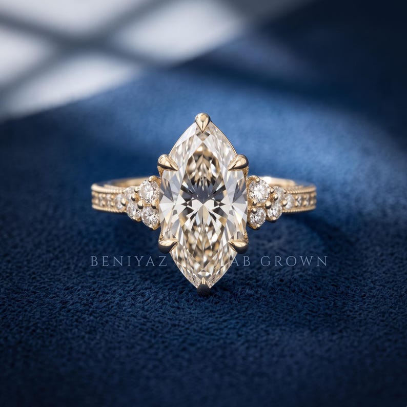 3 CT marquise lab grown diamond engagement ring in yellow gold with vintage inspired pave and cluster diamond accents.