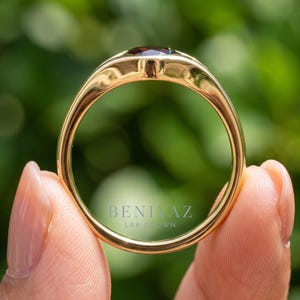 Rear profile of gemstone signet style ring showing smooth tapered shank and polished low profile single stone design.