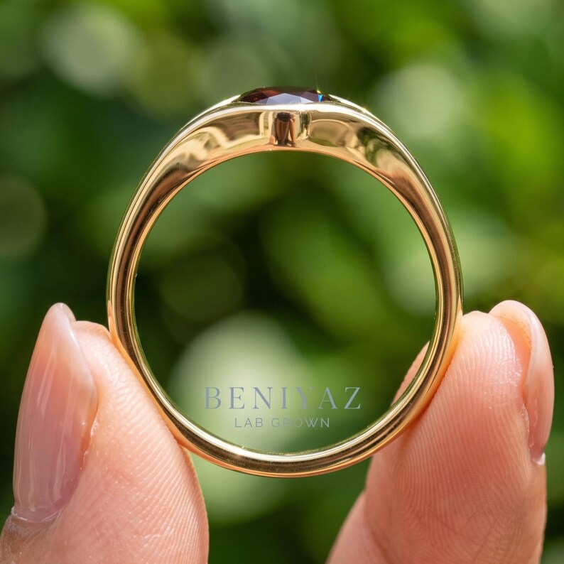 Rear profile of gemstone signet style ring showing smooth tapered shank and polished low profile single stone design.