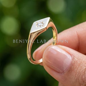 Gold signet ring rear view showing the slim tapered shank, polished finish and elongated geometric signet face.
