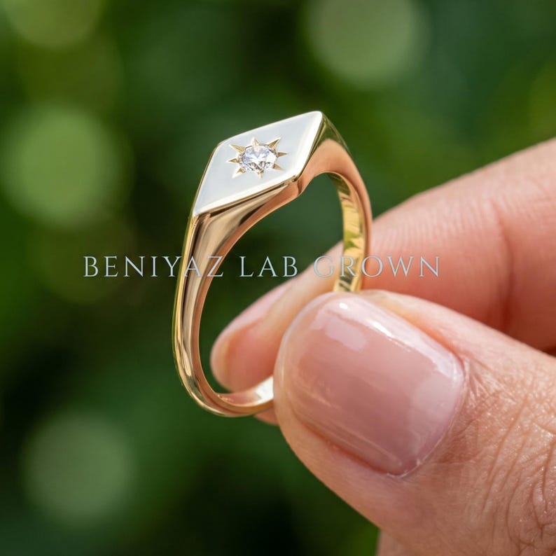 Gold signet ring rear view showing the slim tapered shank, polished finish and elongated geometric signet face.