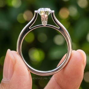 Close detail of Dutch marquise solitaire ring showing the pointed lab grown diamond shape and secure V tip prongs.
