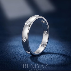 Standing profile of a flush set lab grown diamond wedding band showing all-around stones. BENIYAZ.
