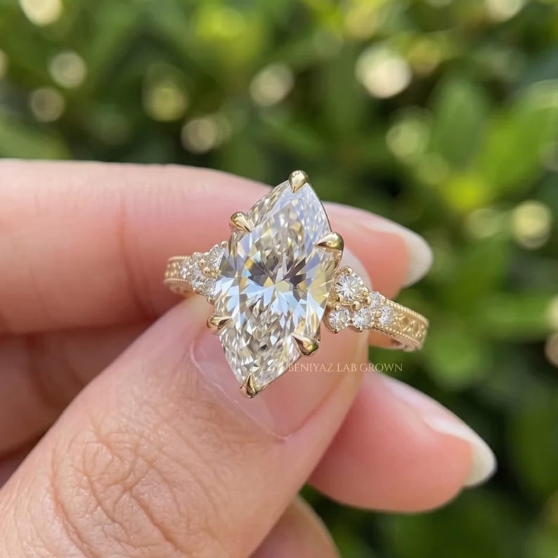 Back profile of a marquise lab grown diamond engagement ring showing the circular shank and raised centre setting.