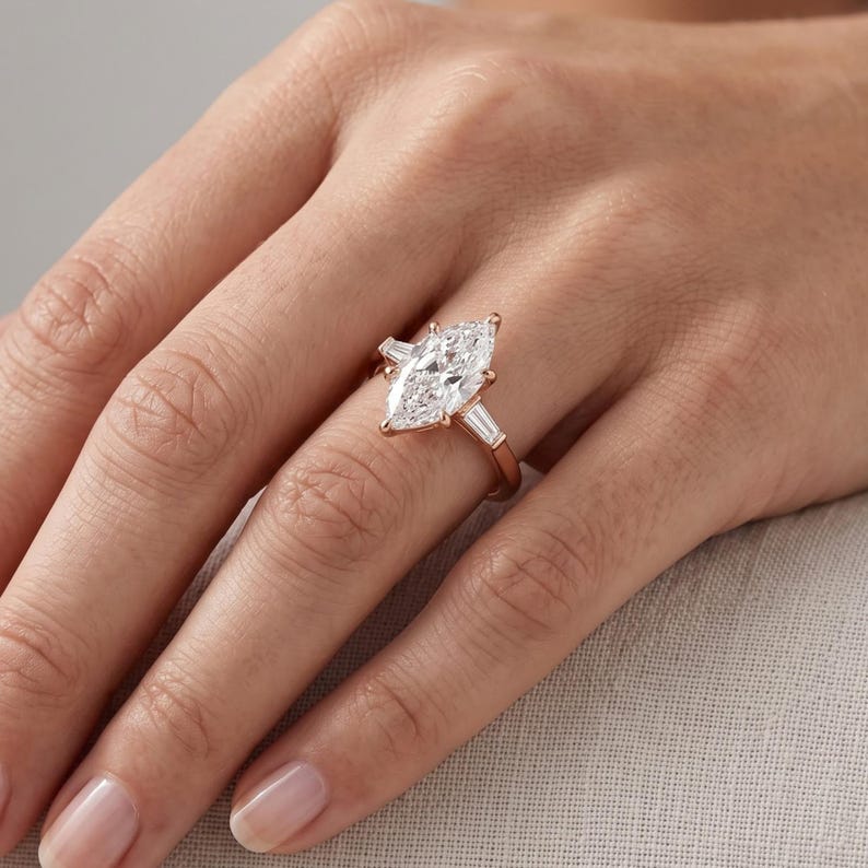 Woman wearing Dutch marquise lab grown diamond engagement ring with elongated center stone in an elegant bridal look