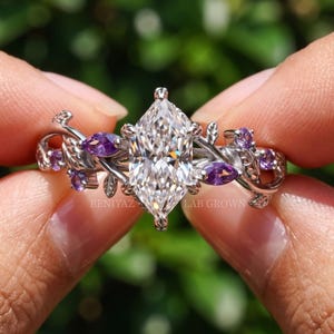 Nature inspired ring front view with F VS Dutch marquise lab grown diamond and asymmetrical botanical vine detailing.