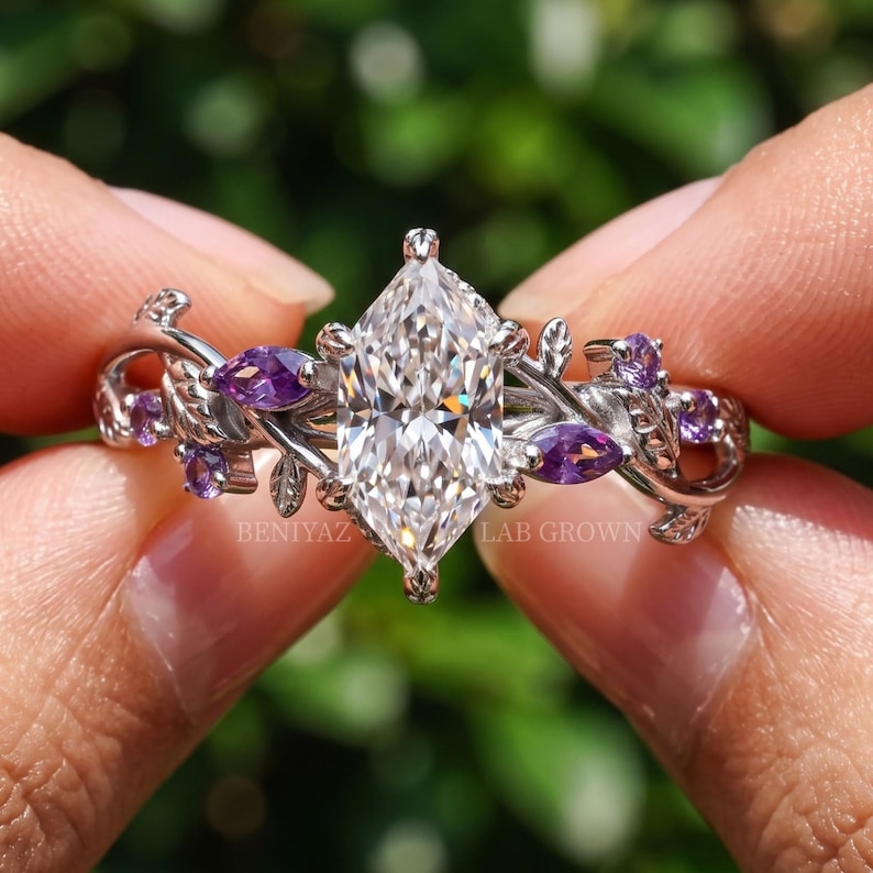 Nature inspired ring front view with F VS Dutch marquise lab grown diamond and asymmetrical botanical vine detailing.