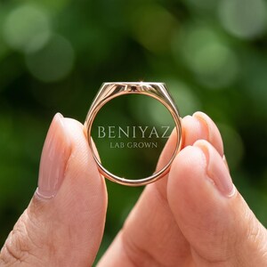 Back and inside view of personalized oval signet ring showing tapered shank, polished interior and vintage shoulder detailing